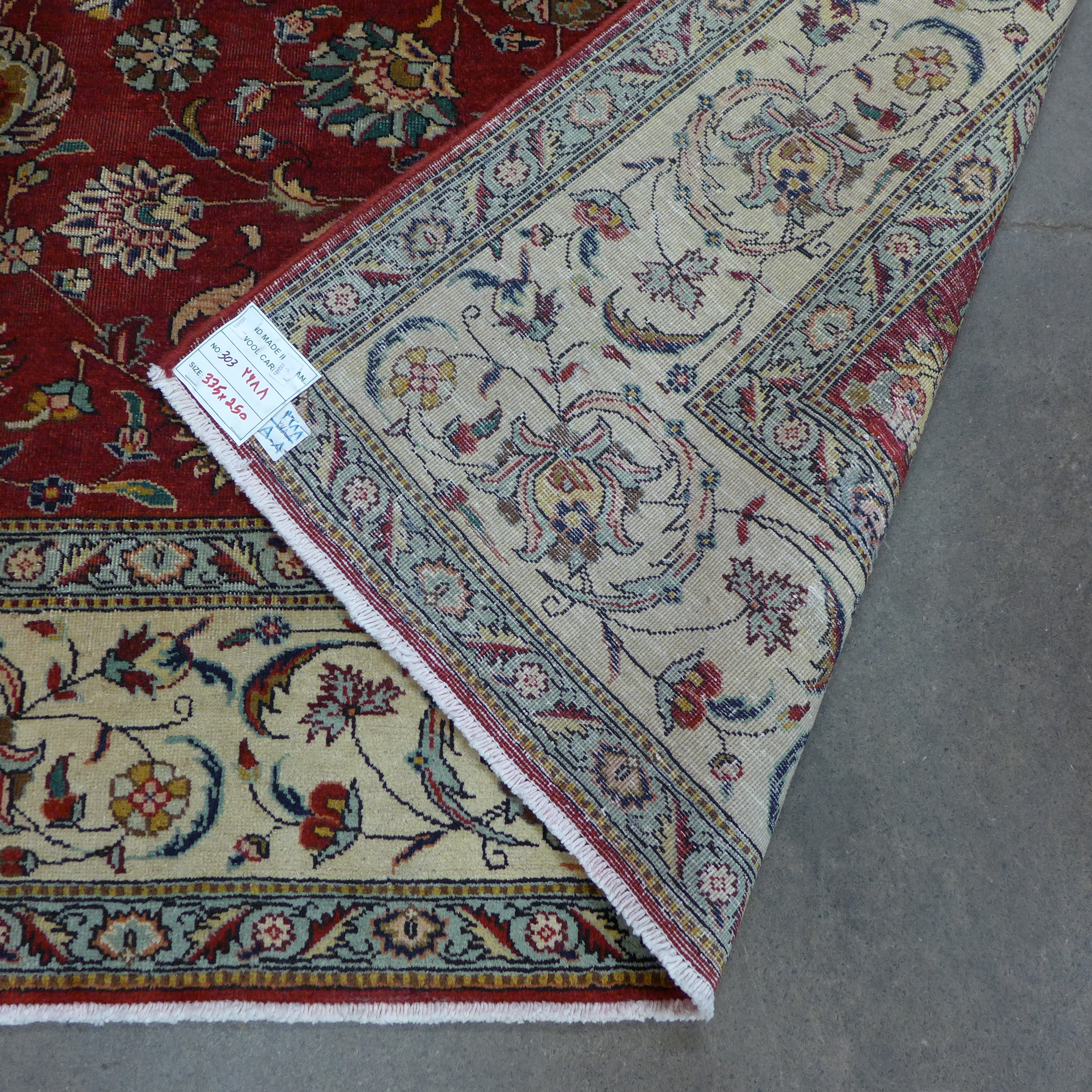 A Persian hand made red ground rug, 335 x 250cms - Image 2 of 2