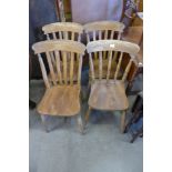 A set of four Victorian beech and elm kitchen chairs