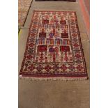 An eastern cream ground rug, 200 x 122cms