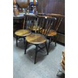 A set of four Victorian beech penny seat kitchen chairs