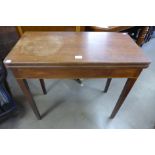 A George III mahogany fold over rectangular tea table