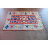 An eastern multi coloured hand knotted rug, 170 x 116cms