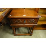 An Old Charm carved oak side table