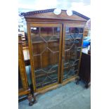 A 19th Century carved oak astragal glazed two door bookcase