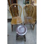 A pair of elm and beech wheelback Windsor chairs and a beech stool