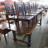 A large pine refectory table and ten Thakat hardwood chairs