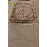 An eastern beige ground rug, 206 x 150cms