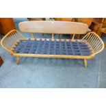 An Ercol Blonde elm and beech 355 model studio couch