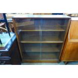 A Herbert Gibbs teak bookcase and a light oak bookcase