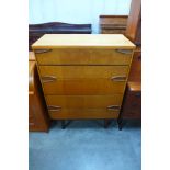 A teak chest of drawers