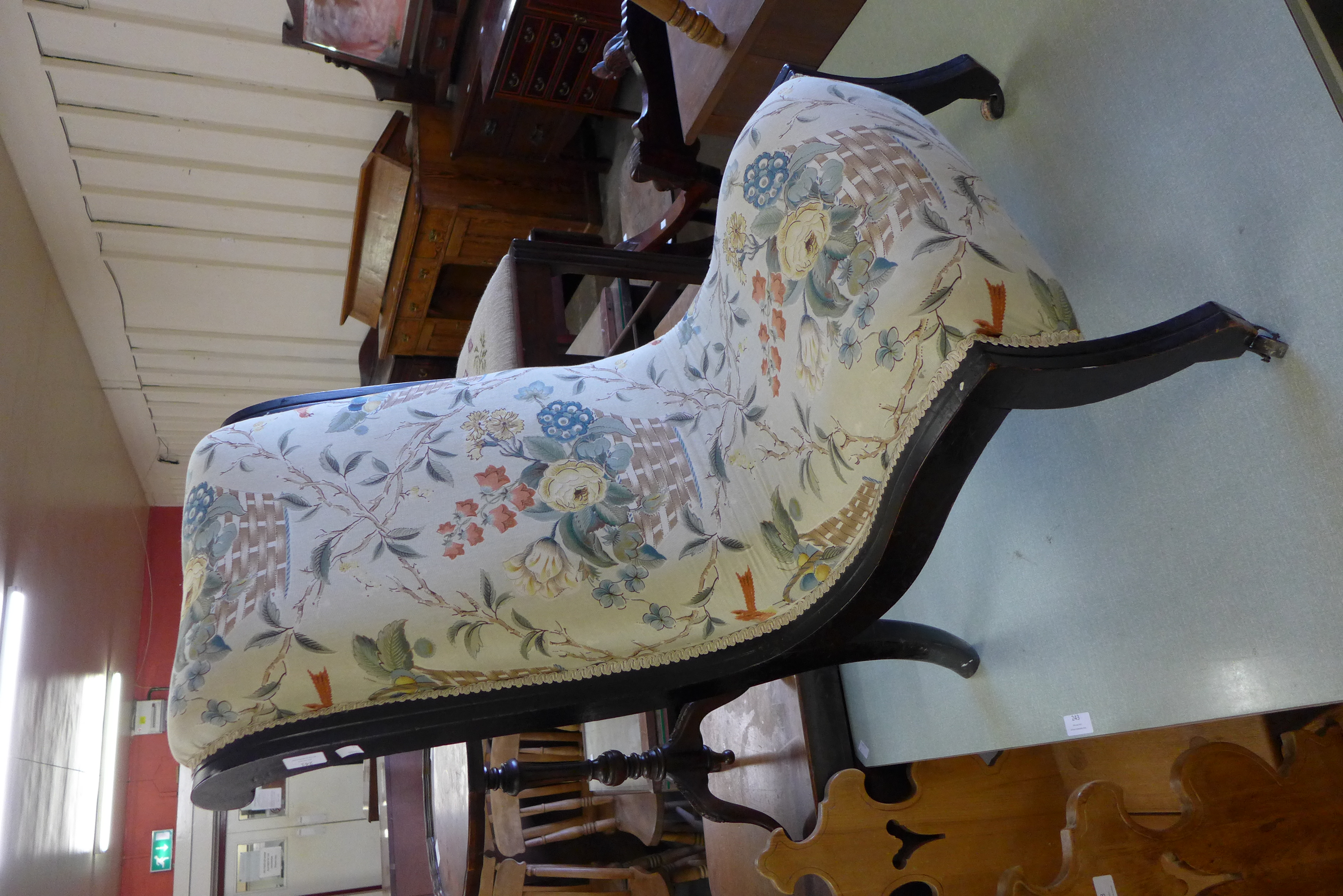 A Victorian Aesthetic Movement ebonised and fabric upholstered nursing chair