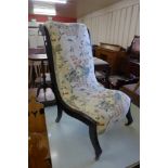 A Victorian Aesthetic Movement ebonised and fabric upholstered nursing chair