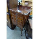 An Edward VII mahogany music cabinet