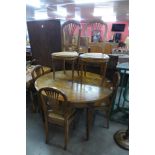 A 19th Century French circular inlaid walnut dining table and five chairs, a/f (signs of old