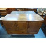 An Ercol Golden Dawn elm and beech Windsor sideboard