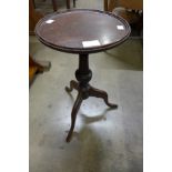 A mahogany tripod wine table