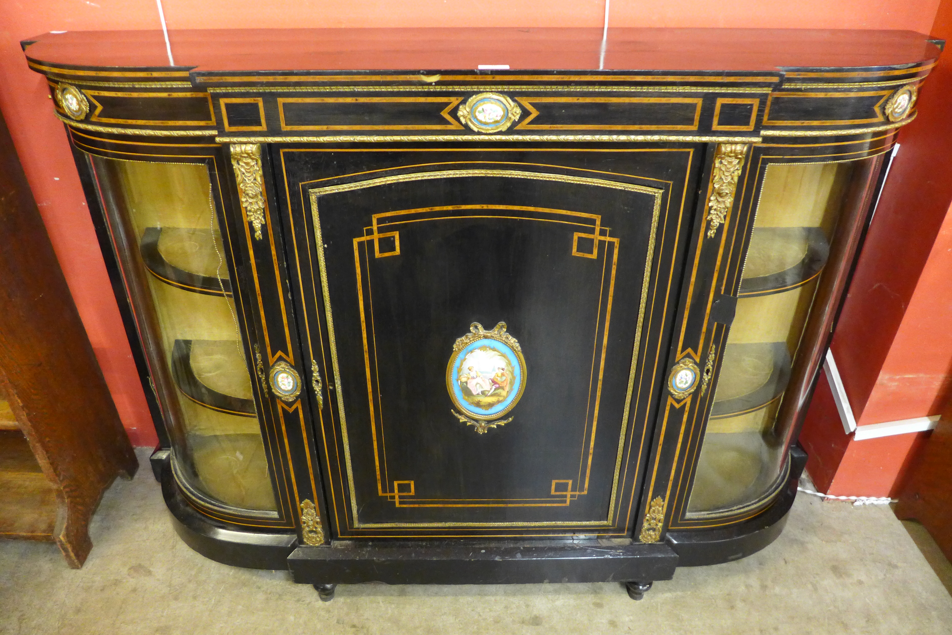 A Victorian ebonised and brass mounted credenza