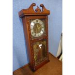 A mahogany wall clock and a box of assorted vintage items