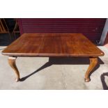 A Victorian walnut extending dining table