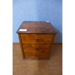 A Victorian inlaid walnut table top three drawer chest