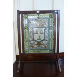 An Arts and Crafts mahogany and leaded glass armorial fire screen, painted with Whalley Family,