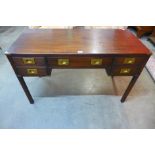 A mahogany and brass mounted campaign style desk