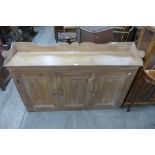 A Victorian pine three door housekeepers cupboard