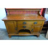 An Arts and Crafts Maple & Co. Ltd. oak sideboard