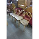 Four Ercol Blonde elm and beech Windsor chairs