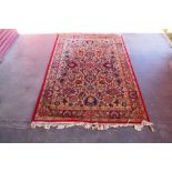 An eastern red ground rug, 200 x 140cms