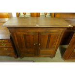 A George III oak two door cupboard