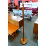 A teak standard lamp