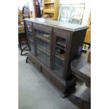 An early 20th Century beech three door bookcase