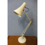 A white metal industrial anglepoise lamp