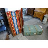 An early 20th Century steamer trunk and two deck chairs