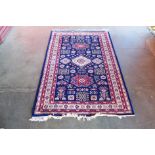 An eastern blue ground rug, 185 x 128cms