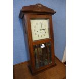 An Art Deco beech wall clock