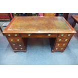 A Victorian oak pedestal library desk