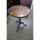 A Reprodux mahogany tripod wine table