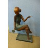 An Art Deco style bronze figure of a seated lady with mirror
