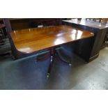 A George IV mahogany rectangular tilt top dining table