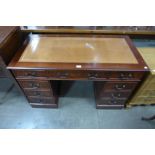 A mahogany pedestal desk