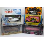 Four Corgi die-cast model vehicles comprising Charlie's Angels, Return of The Saint, Kojak and Elvis