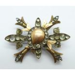 An antique gold and silver brooch set with rose cut stones