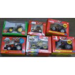 Five Britains and one Siku model tractors, boxed