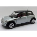 A Kyosho 1:18 scale Mini Cooper model vehicle