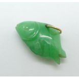 A small carved jadeite charm in the form of a fish