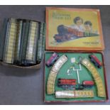 A Chad Valley clockwork train set and a box of train track