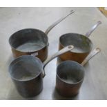 Four heavy copper pans **PLEASE NOTE THIS LOT IS NOT ELIGIBLE FOR POSTING AND PACKING**