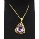 A 9ct gold and amethyst pendant and chain, 2.8g